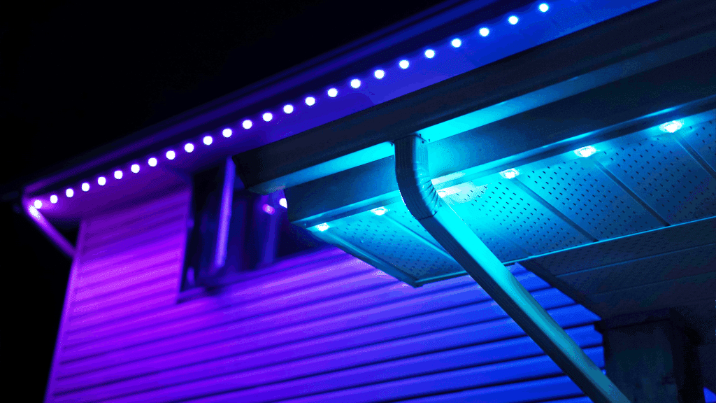 A smartphone screen showing the custom app interface used to select colors, adjust brightness, and set schedules for permanent roofline lighting.