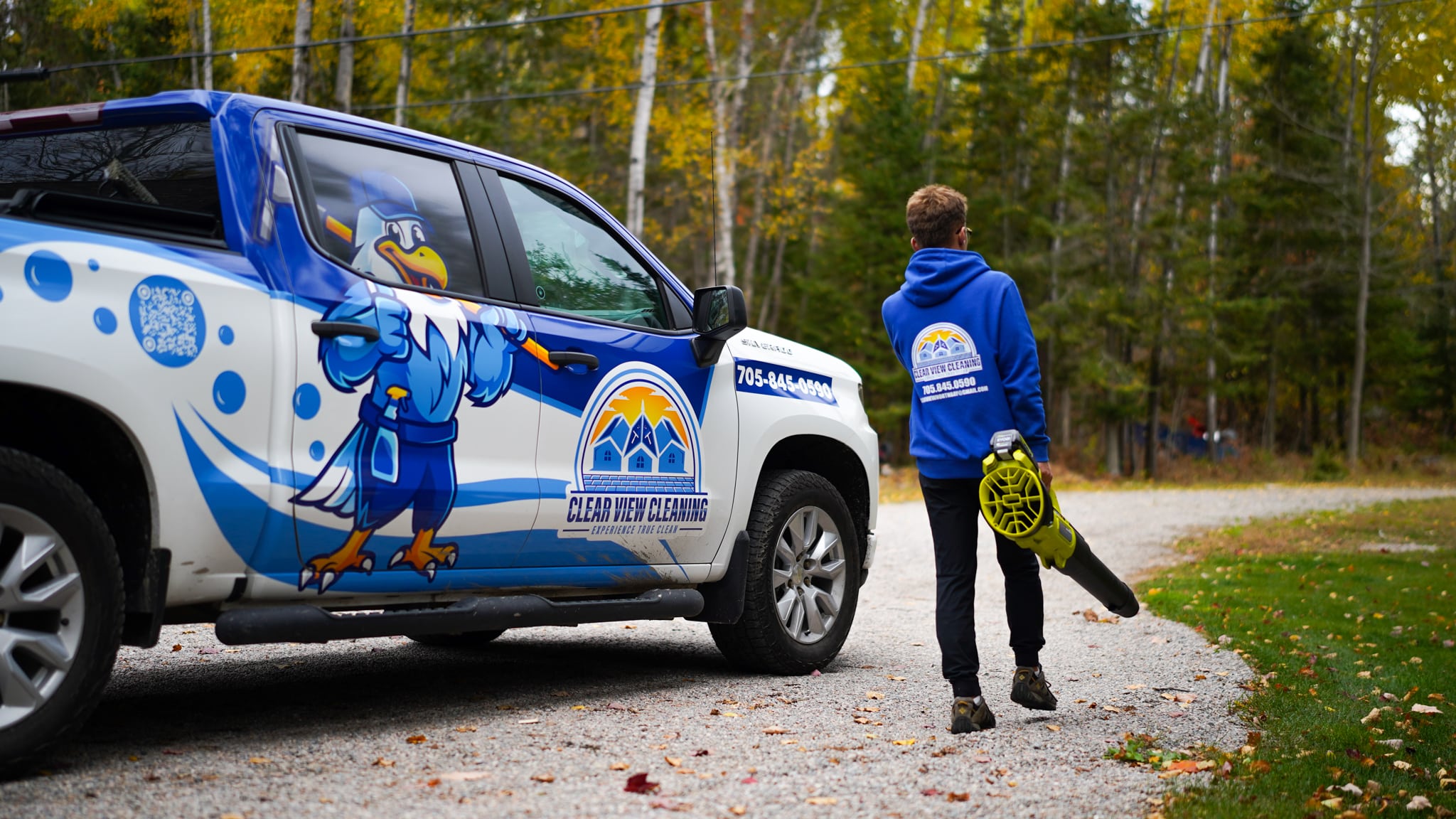 Professional seasonal gutter cleaning and leaf removal service for a Northern Ontario home during the autumn season